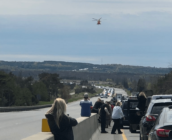 An Ornge Air Ambulance could be seen landing on the highway. People also stepped out of their vehicles as traffic was completely stopped on the highway.