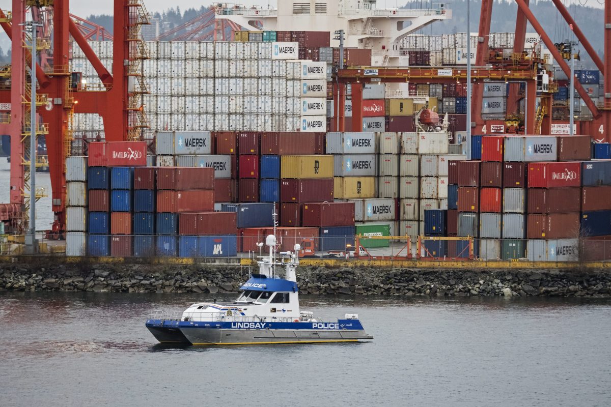 The RCMP patrol vessel "Lindsay" passes by the Port of Vancouver's container facility, Vancouver, B.C. on Friday, January 18, 2019. 