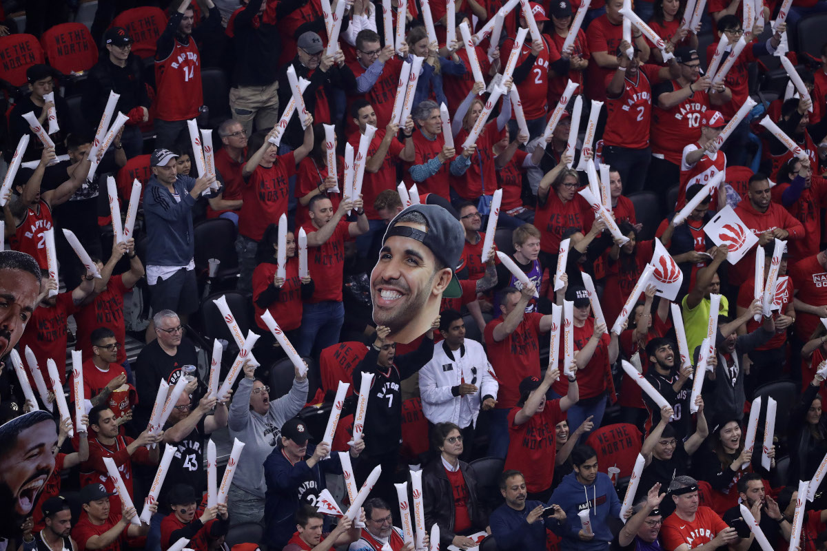 Fans with thunder sticks and a Drake cut-out cheer as the Toronto Raptors beat the Milwaukee Bucks in game six to win the NBA Eastern Conference Final  in Toronto.