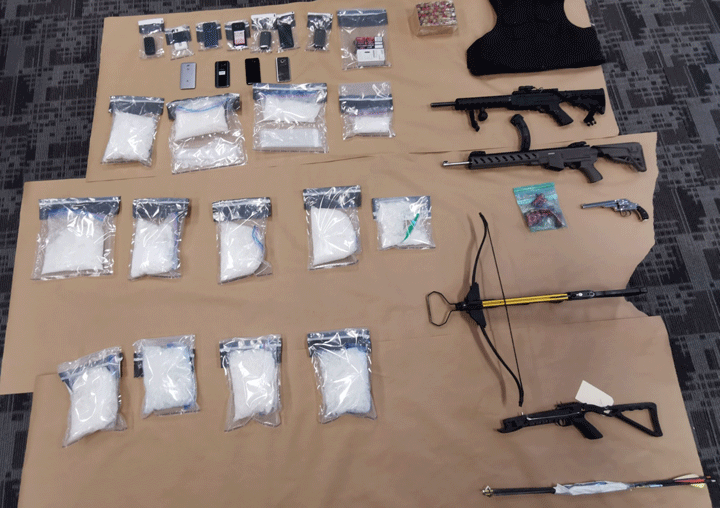 Saskatoon police seized crystal meth, guns and a crossbow during four searches in and near the city on May 23, 2019.