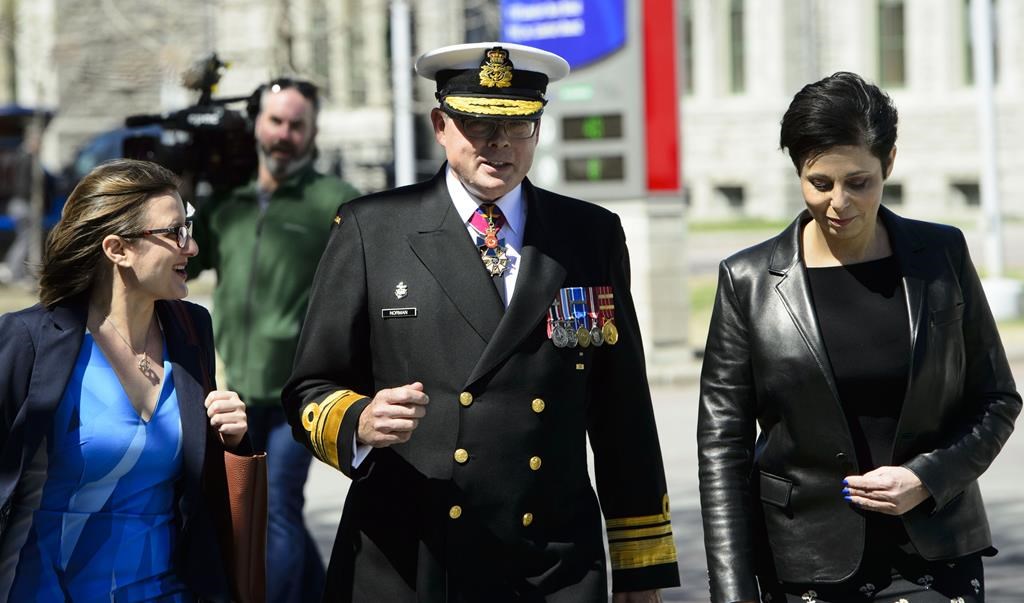 Vice-Admiral Mark Norman walks with his lawyers Marie Henein and Christine Mainville as they leave court in Ottawa on Wednesday, May 8, 2019.