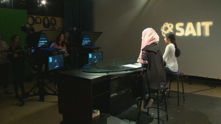 Grade 9 girls put together a newscast at SAIT on Wednesday as part of the Explore STEM program.