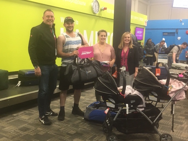 William and Emily Burchat are the winners of a free flight, after arriving in Hamilton as Swoop's $1,000,000 travellers.   Swoop President and CEO Steven Greenway and Hamilton International Airport CEO Cathie Puckering surprised them with the prize this week.  