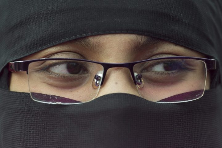 A woman takes part in a demonstration against racism in Montreal, Sunday, Oct. 7, 2018. 