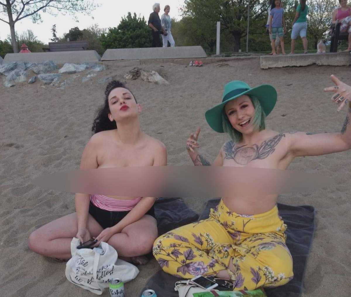 Couple remove tops after being accused of lewd behaviour on a Kelowna beach.