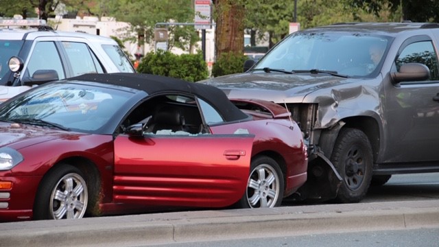 RCMP boxed in a car at 104 Avenue and King George Boulevard during a police pursuit early Friday.