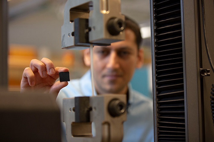 UBC Okanagan engineering researcher Mohammad Arjmand holds a polymer-based brake pad that could revolutionize braking systems in cars and trains.