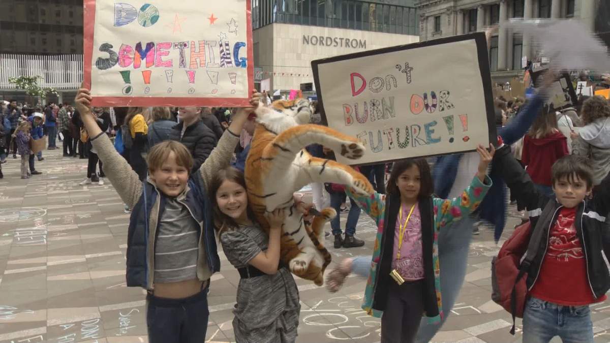 Students walk out of classes in Vancouver for a Climate Strike on Friday. 