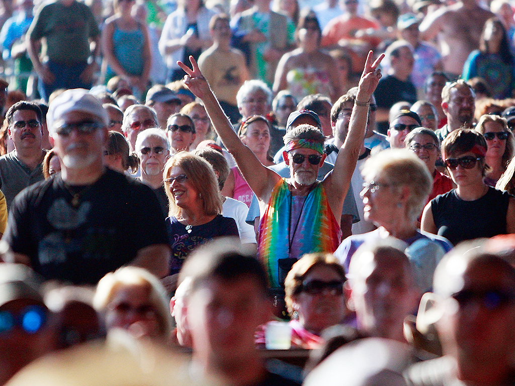 A fan flashes the peace sign during the concert marking the 40th anniversary of the Woodstock music festival on August 15, 2009 in Bethel, New York. 
