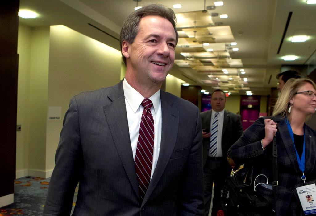 In this Feb. 23, 2019, file photo, Montana Gov. Steve Bullock walks to a meeting during the National Governors Association 2019 winter meeting in Washington.