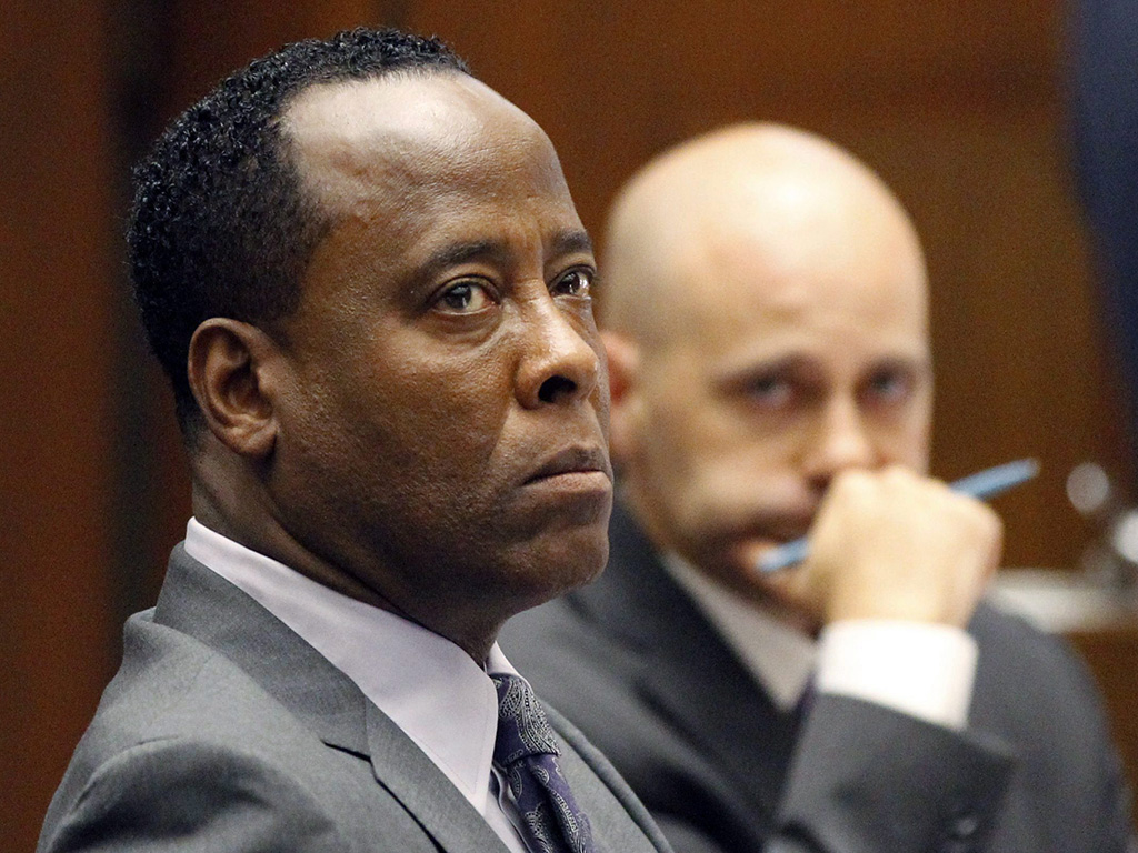 (L-R) Dr. Conrad Murray listens to testimony, seated near his attorney, Nareg Gourjian, during Murray’s trial in the death of pop star Michael Jackson.