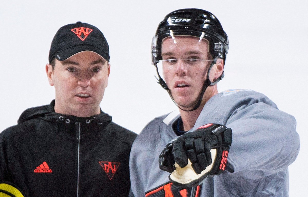 Team North America player Connor McDavid, right, talks with assistant coach Jay Woodcroft during training camp in Montreal, Monday, September 5, 2016, ahead of the 2016 World Cup of Hockey competition. 