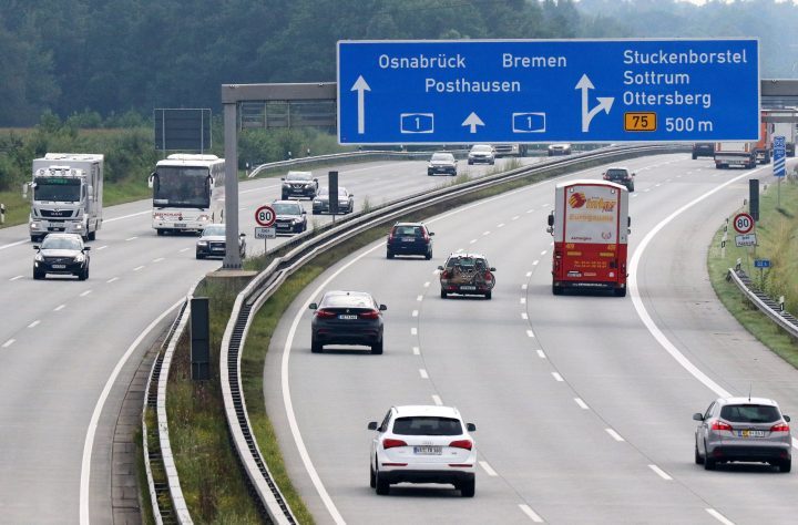 Cars and trucks drive past on the Autobahn A1 near Sottrum, northern Germany. 