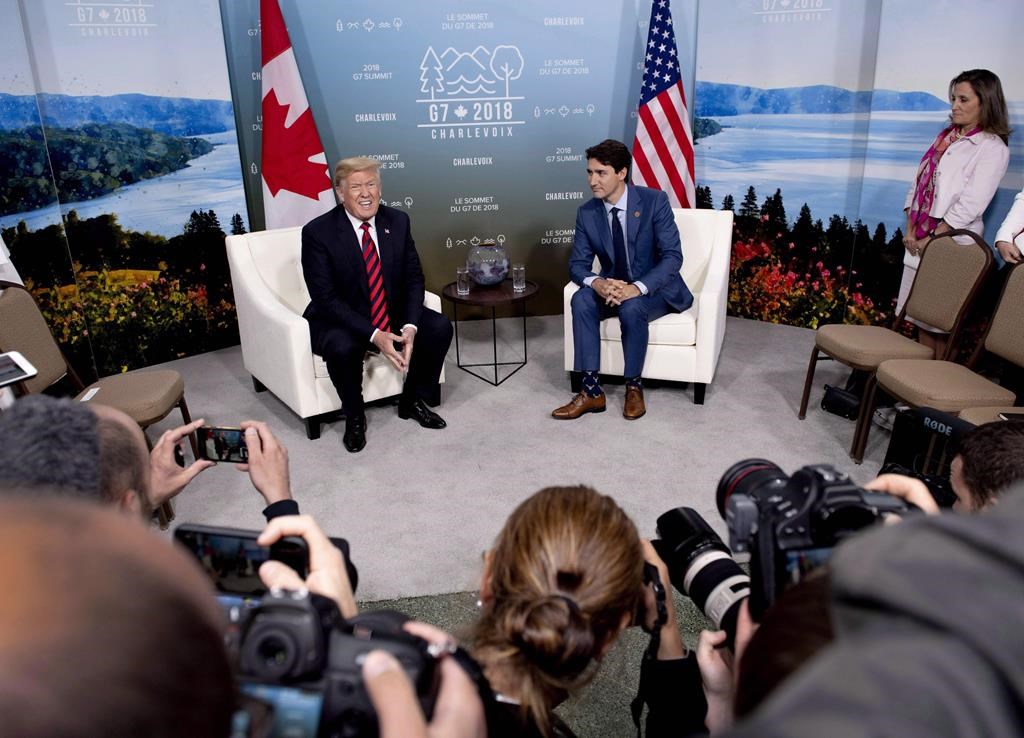 Canada's Prime Minister Justin Trudeau meets with U.S. President Donald Trump at the G7 leaders summit in Quebec on June 8, 2018. Prime Minister Justin Trudeau says his meeting with U.S. President Donald Trump in Washington on Thursday will be an opportunity to talk about China and global issues set to be discussed at next week's G20 in Osaka, Japan.