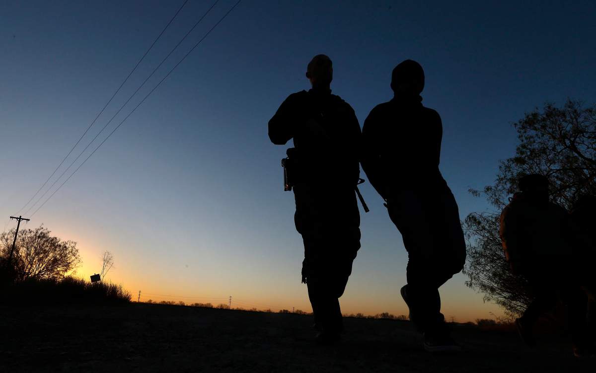 United States Border Patrol agents apprehend people suspected of crossing the Rio Grande River to enter the United States illegally near McAllen, Texas, on Jan. 24, 2019. 