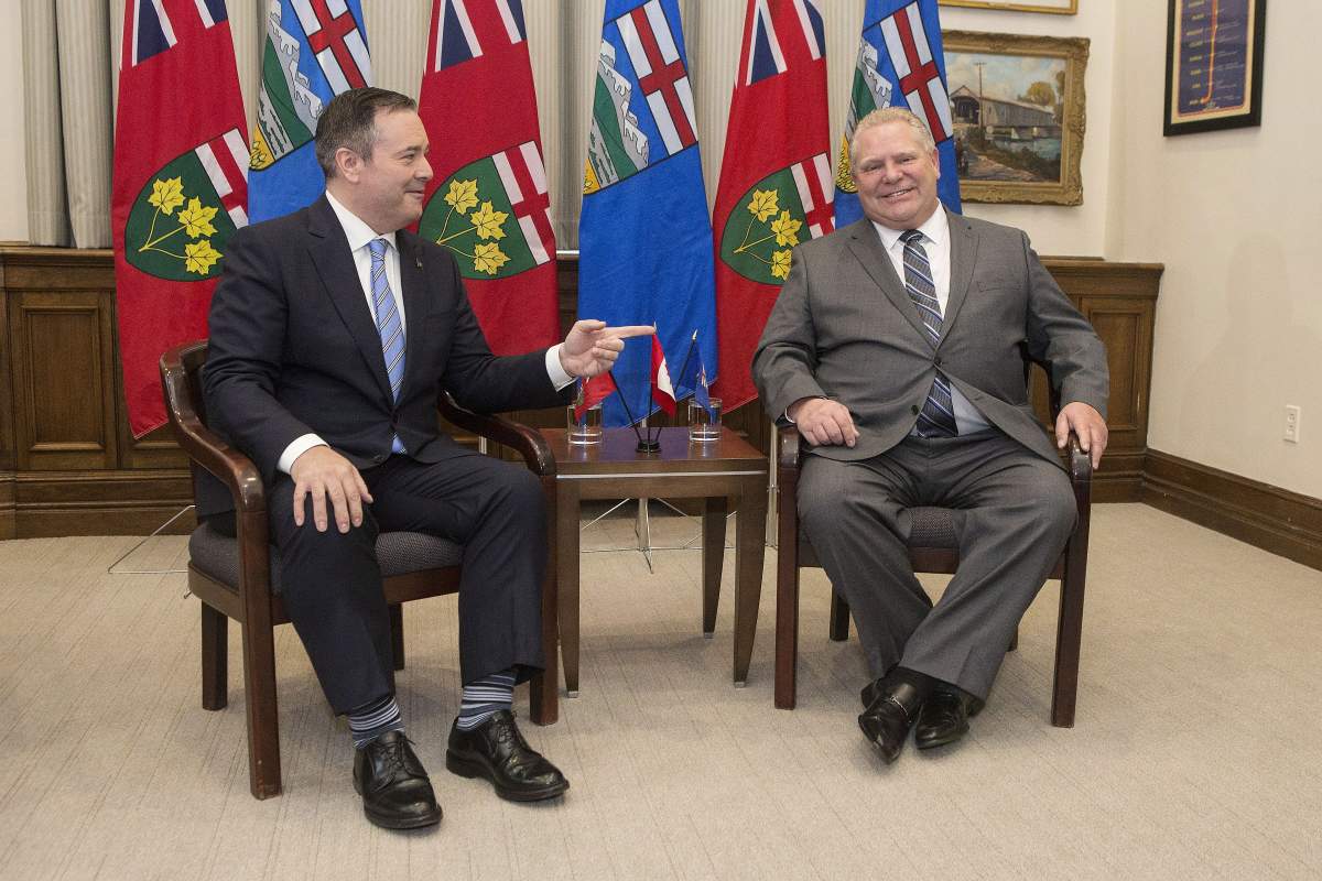 Ontario Premier Doug Ford, right, poses with Alberta Premier Jason Kenney at the Ontario legislature in Toronto on Friday, May 3, 2019. 