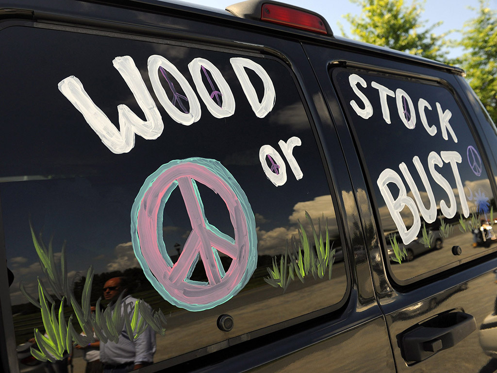 A van decorated with 'Woodstock or Bust' at the original Woodstock Festival site in Bethel, N.Y.
