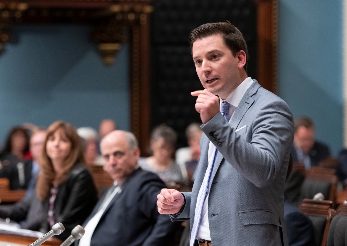 Quebec government House Leader and Minister of Immigration, Diversity and Inclusiveness, Simon Jolin-Barrette responds to the Opposition, Tuesday, June 11, 2019 at the legislature in Quebec City. 