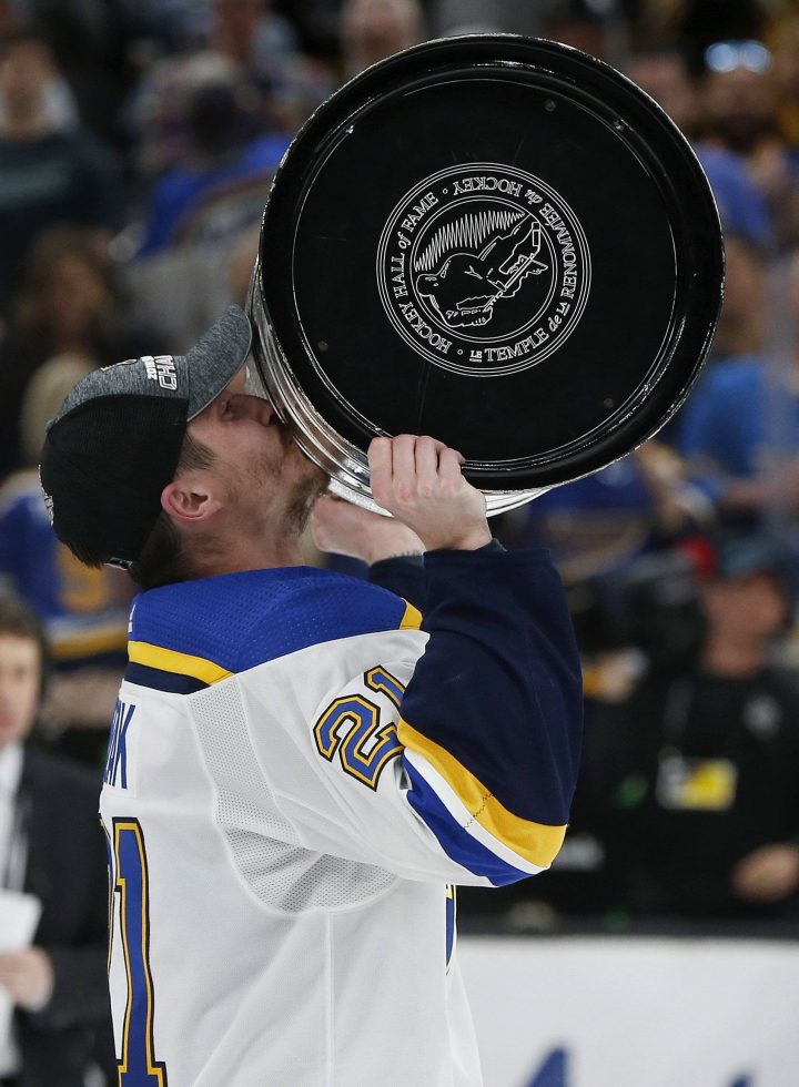 St. Louis Blues' Tyler Bozak kisses the Stanley Cup after the Blues defeated the Boston Bruins in Game 7 of the NHL Stanley Cup Final, Wednesday, June 12, 2019, in Boston. (AP Photo/Michael Dwyer).
