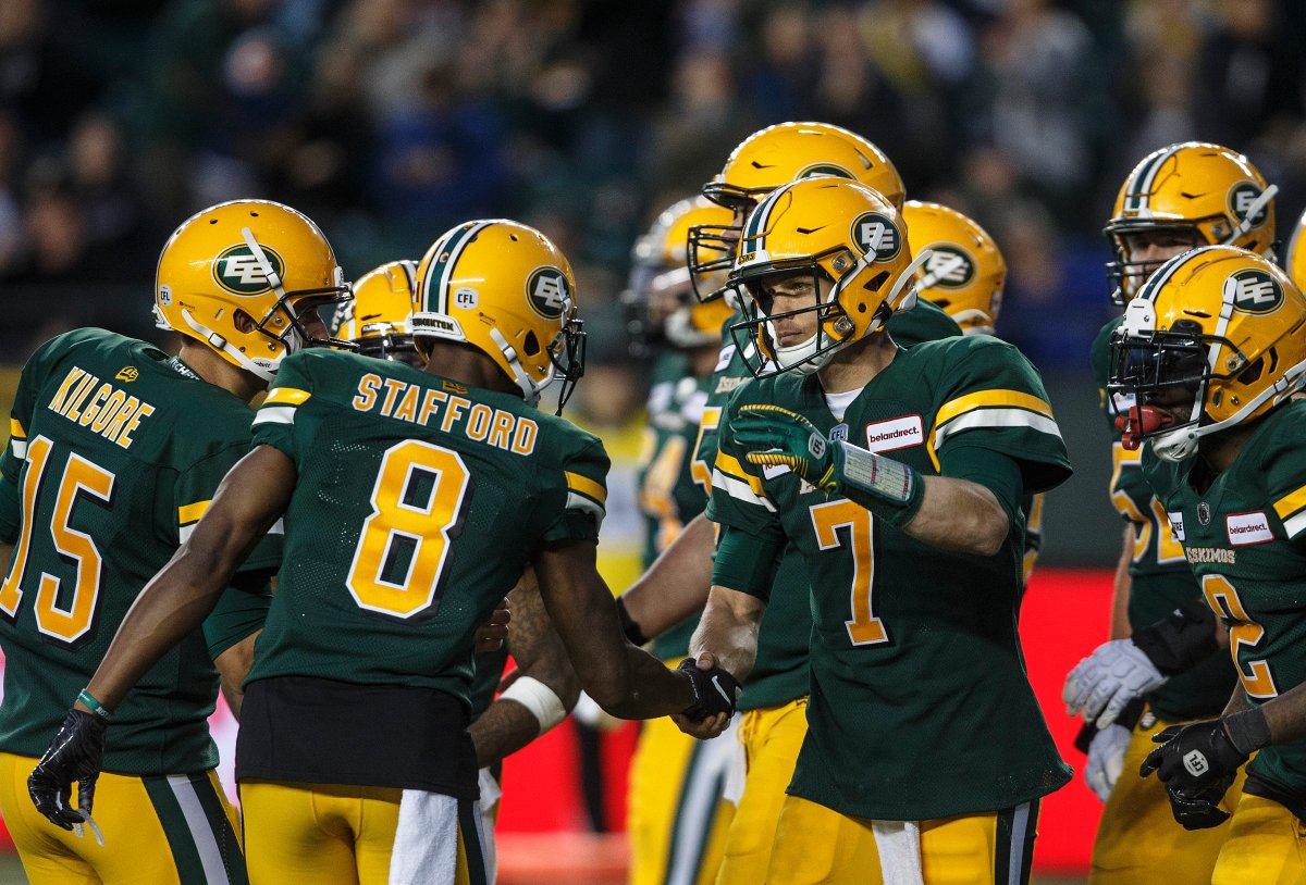 Edmonton Eskimos quarterback Trevor Harris (7) and Kenny Stafford (8) celebrate a touchdown against the Montreal Alouettes during second half CFL action in Edmonton on Friday June 14, 2019. 