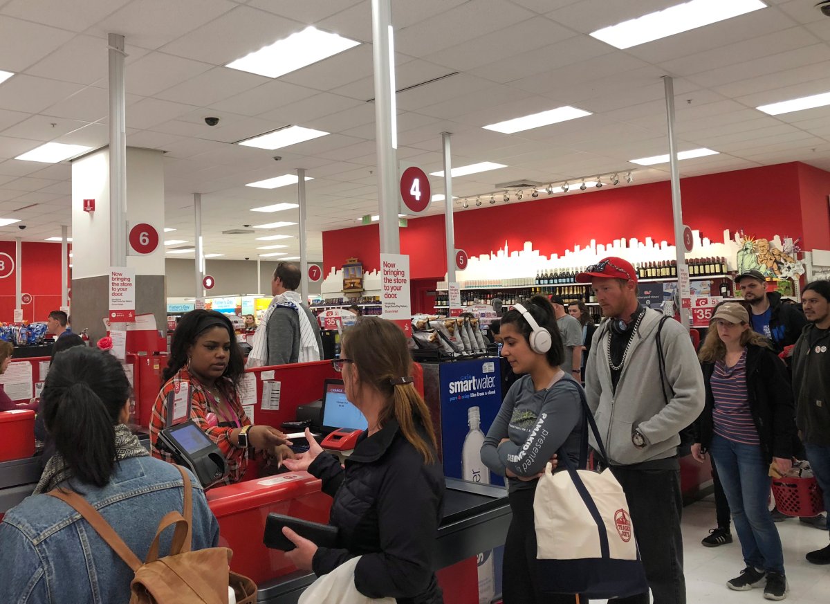 Customers wait on a long check out line at a Target store in San Francisco on Saturday, June 15, 2019.