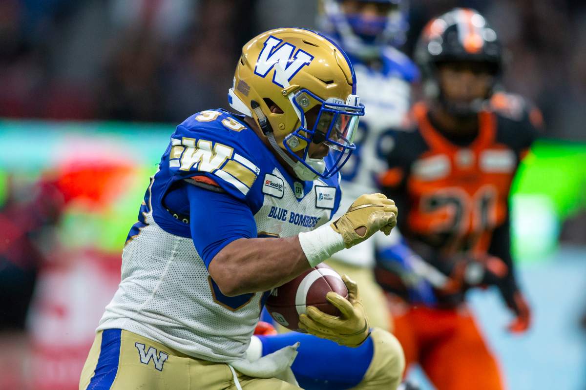 Winnipeg Blue Bombers' Andrew Harris (33) runs the ball against the B.C. Lions during the second half of CFL football action in Vancouver, B.C., on Saturday June 15, 2019. 