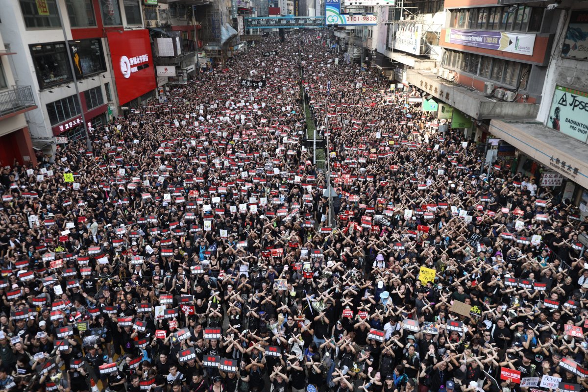 Protesters march to demand a complete withdrawal of an extradition bill in Hong Kong, China, 16 June 2019.