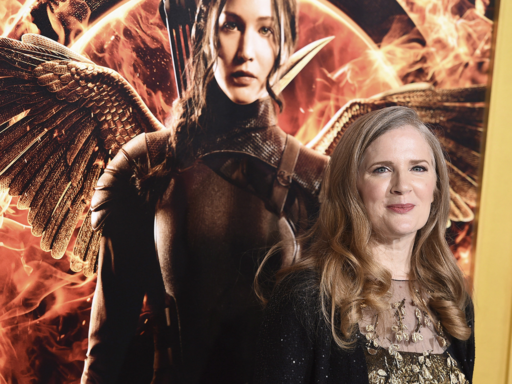 In a Monday, Nov. 17, 2014 file photo, Suzanne Collins arrives at the Los Angeles premiere of 'The Hunger Games: Mockingjay - Part 1' at the Nokia Theatre in Los Angeles, Calif.