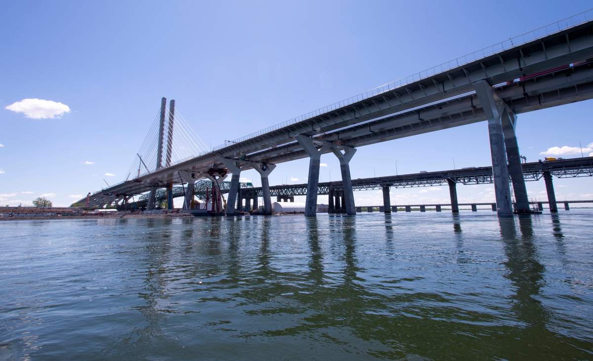 FILE -- The new Samuel de Champlain bridge is seen with the old bridge in the background in Montreal on Monday, June 17, 2019.