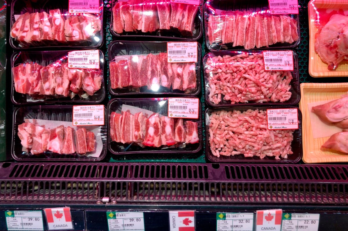 Packs of Canadian pork are displayed for sale at a supermarket in Beijing, Tuesday, June 18, 2019.  