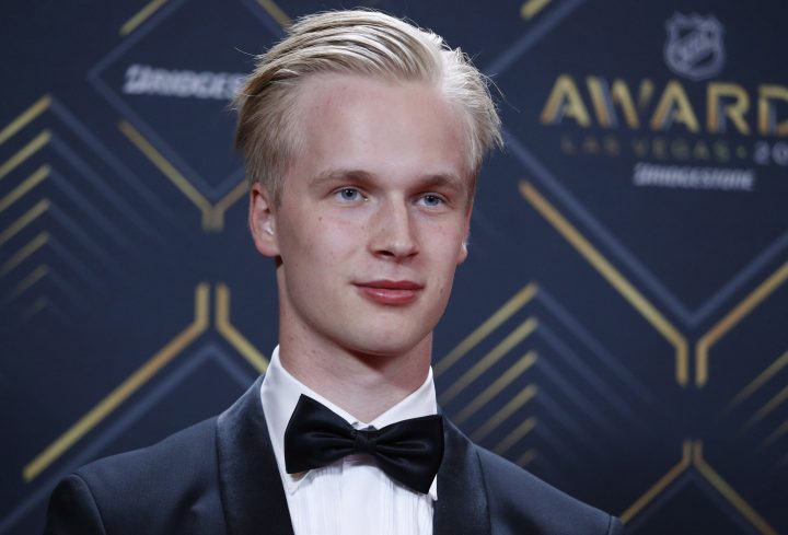 Vancouver Canucks' Elias Pettersson poses on the red carpet before the NHL Awards, Wednesday, June 19, 2019, in Las Vegas. 