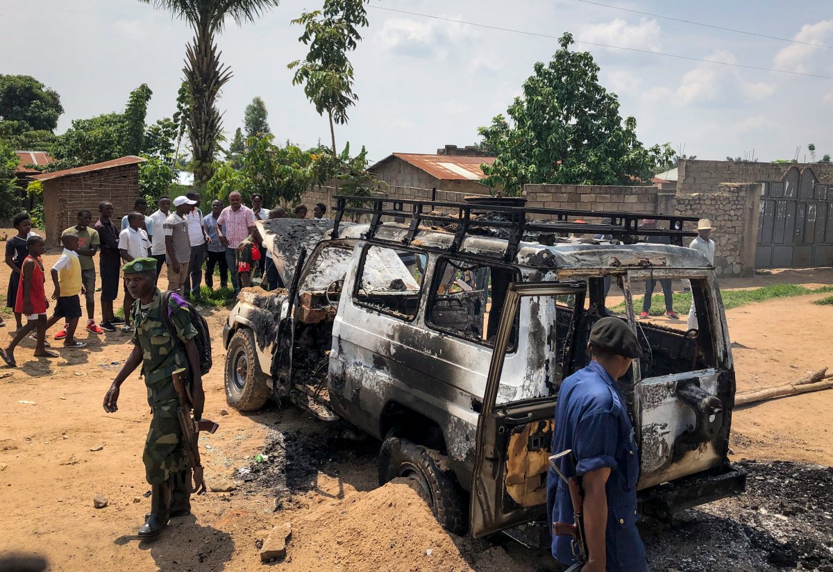 Congolese security forces attend the scene after the vehicle of a health ministry Ebola response team was attacked in Beni, northeastern Congo Monday, June 24, 2019. 