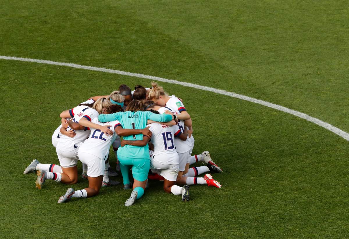 United States players celebrate at the end of the Women's World Cup round of 16 soccer match between Spain and United States at Stade Auguste-Delaune in Reims, France, Monday, June 24, 2019. 