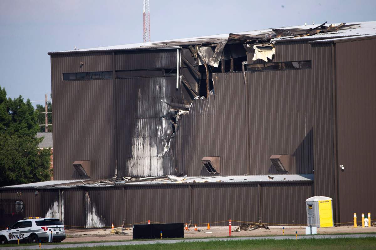 Damage is seen to a hangar after a twin-engine plane crashed into the building at Addison Airport in Addison, Texas, Sunday, June 30, 2019.