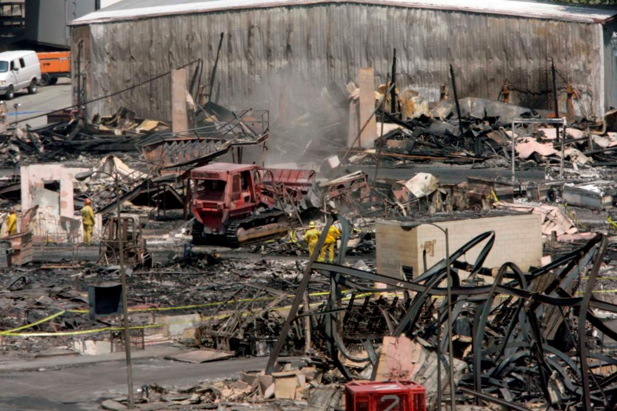 Firefighters examine the scene on the fire-damaged lot of Universal Studios Monday, June 2, 2008.