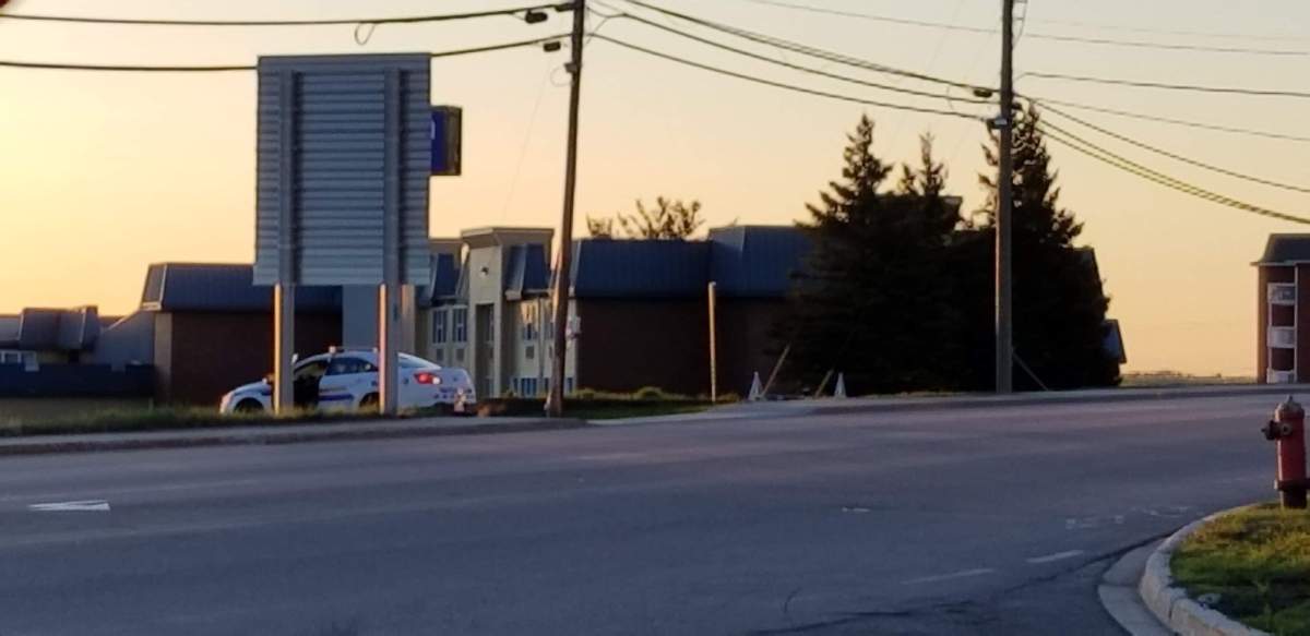 A police car parked next to a hotel on Mountain Road, where cocaine and other drugs were seized. 