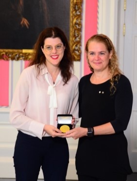 Winnipeg researcher Tracie Afifi, left, receives an award from Governor General Julie Payette in Ottawa.