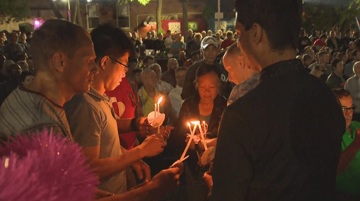 Community members honour those who have died from AIDS-related illnesses .