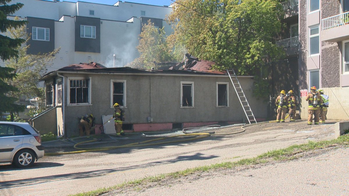 Calgary fire crews seen at a vacant home that caught fire in Bankview on Friday. 