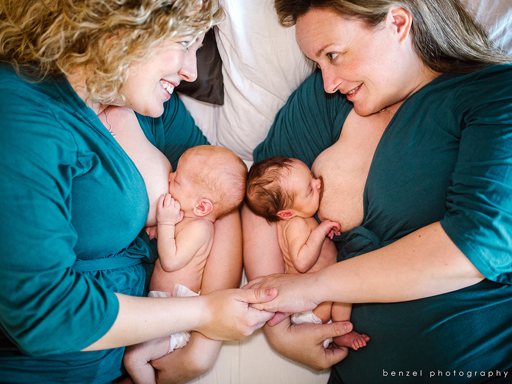 Jaclyn (left) and Kelly (right) Pfeiffer breastfeeding their twins. Courtesy of Melissa Benzel.