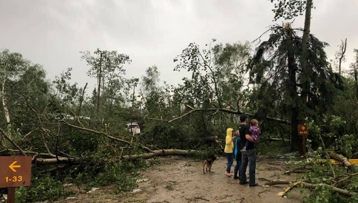 Ashley Cross’s family stands in what’s left of the campground.