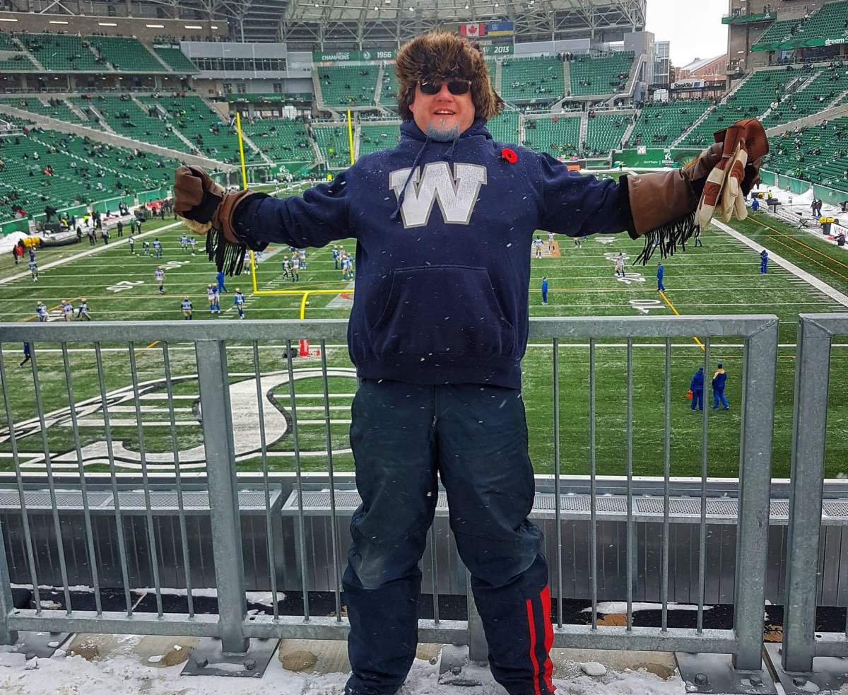 Winnipeg Blue Bombers fan Cory Szczepanski supporting his team in enemy territory.