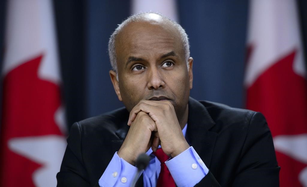 Minister of Immigration, Refugees and Citizenship Ahmed Hussen pauses in Ottawa on Tuesday, May 7, 2019. Immigration Minister Ahmed Hussen says he is concerned by numbers in a new poll that suggest a majority of Canadians believe the government should limit the number of immigrants it accepts since the country might be reaching a limit to its ability to integrate them.
