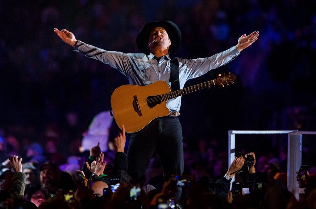 Garth Brooks performs before a sold-out crowd at Notre Dame Stadium Saturday, Oct. 20, 2018, in South Bend, Ind.