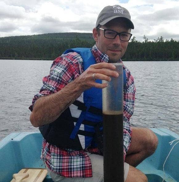 Environmental scientist and lead author Dr. Josh Kurek with a lake sediment core from Sinclair Lake, New Brunswick is shown in this handout image.