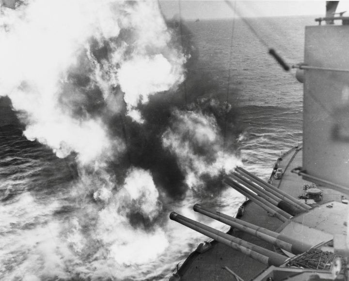 Forward 14/45 guns of the U.S. navy battleship USS Nevada fire on positions ashore during the D-Day landings on Utah Beach in Normandy, France on June 6, 1944.