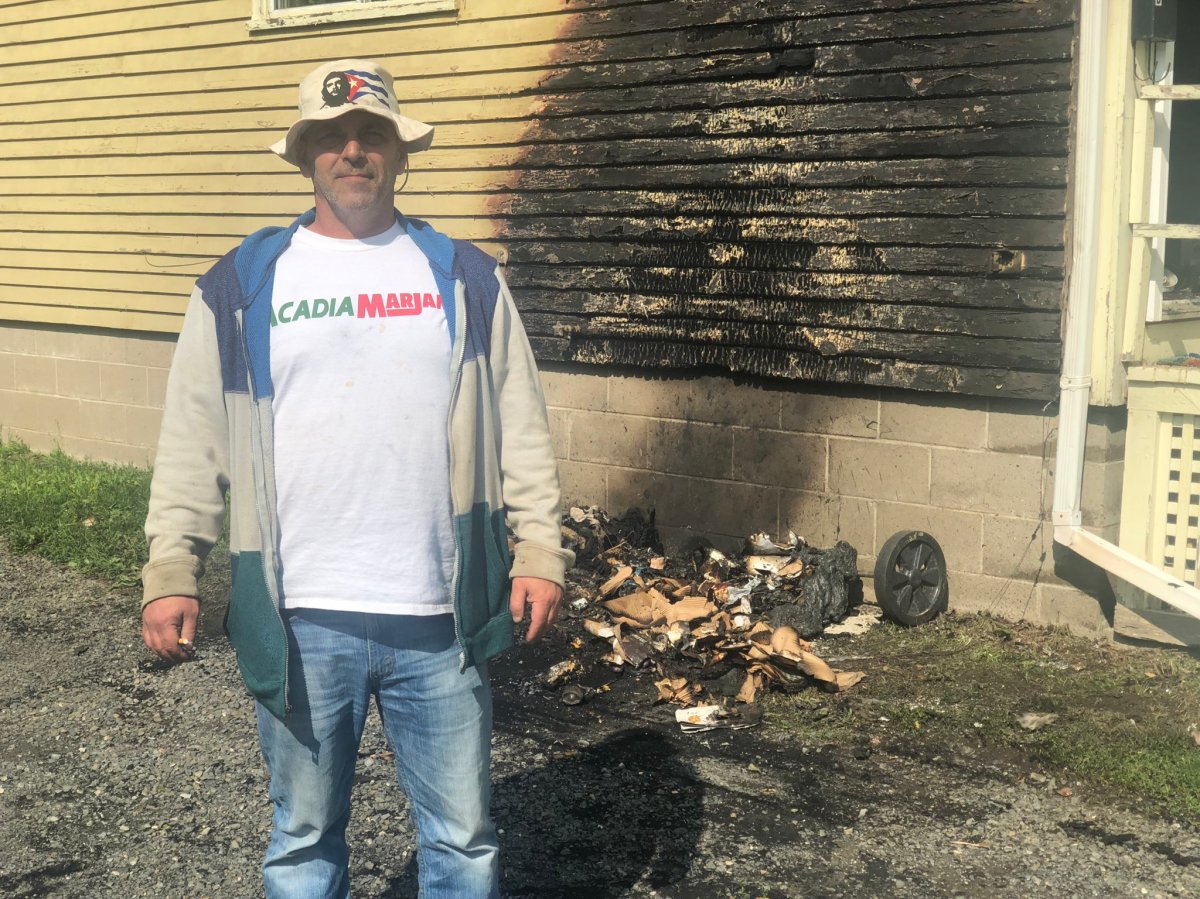 Richard Clark poses in front of his home on Forest Hill Road in Fredericton, N.S., after a fire that occurred on the morning of June 24, 2019.  