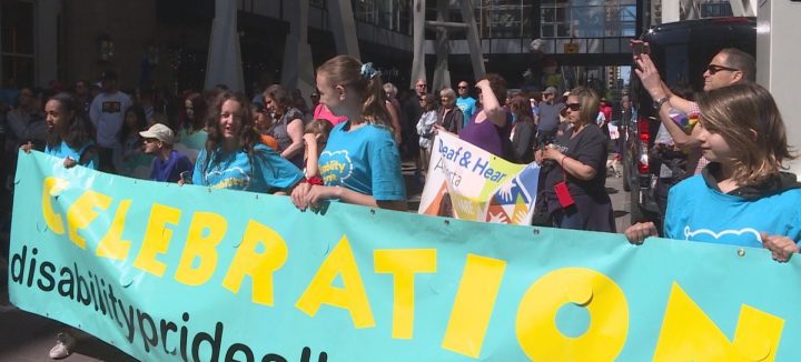 People paraded down Stephen Avenue in Calgary on Sunday, June 9, 2019 to celebrate Disability Pride.