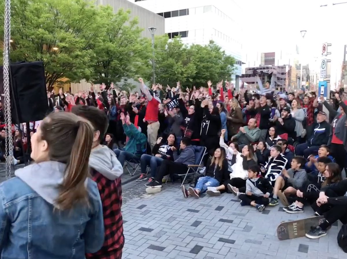 Fans cheer on the Toronto Raptors during an NBA Finals viewing party on London's Dundas Place.