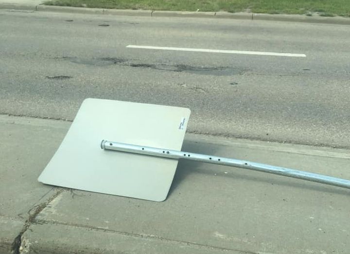 A photo of a sign that a witness told Global News was knocked over by a school bus in west Edmonton on Tuesday.